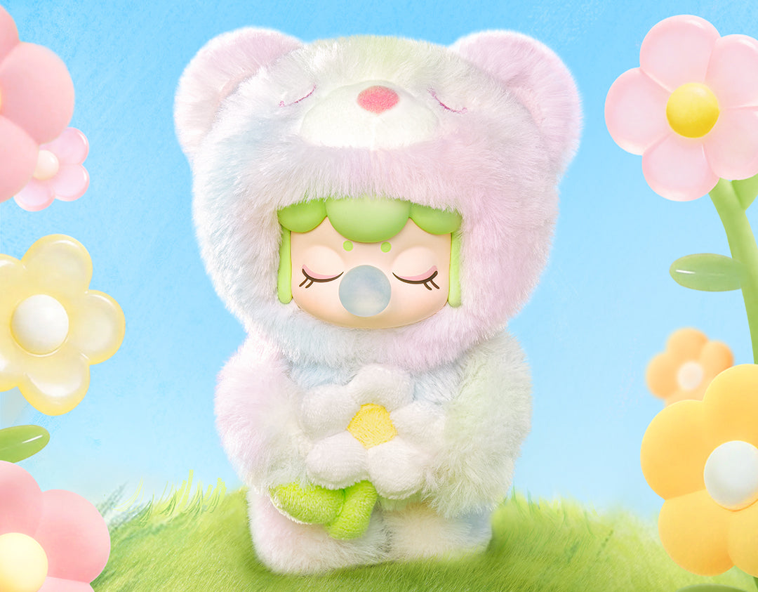 Rolife Nanci Spring Bear MN003 front view with flower and pastel spring background.