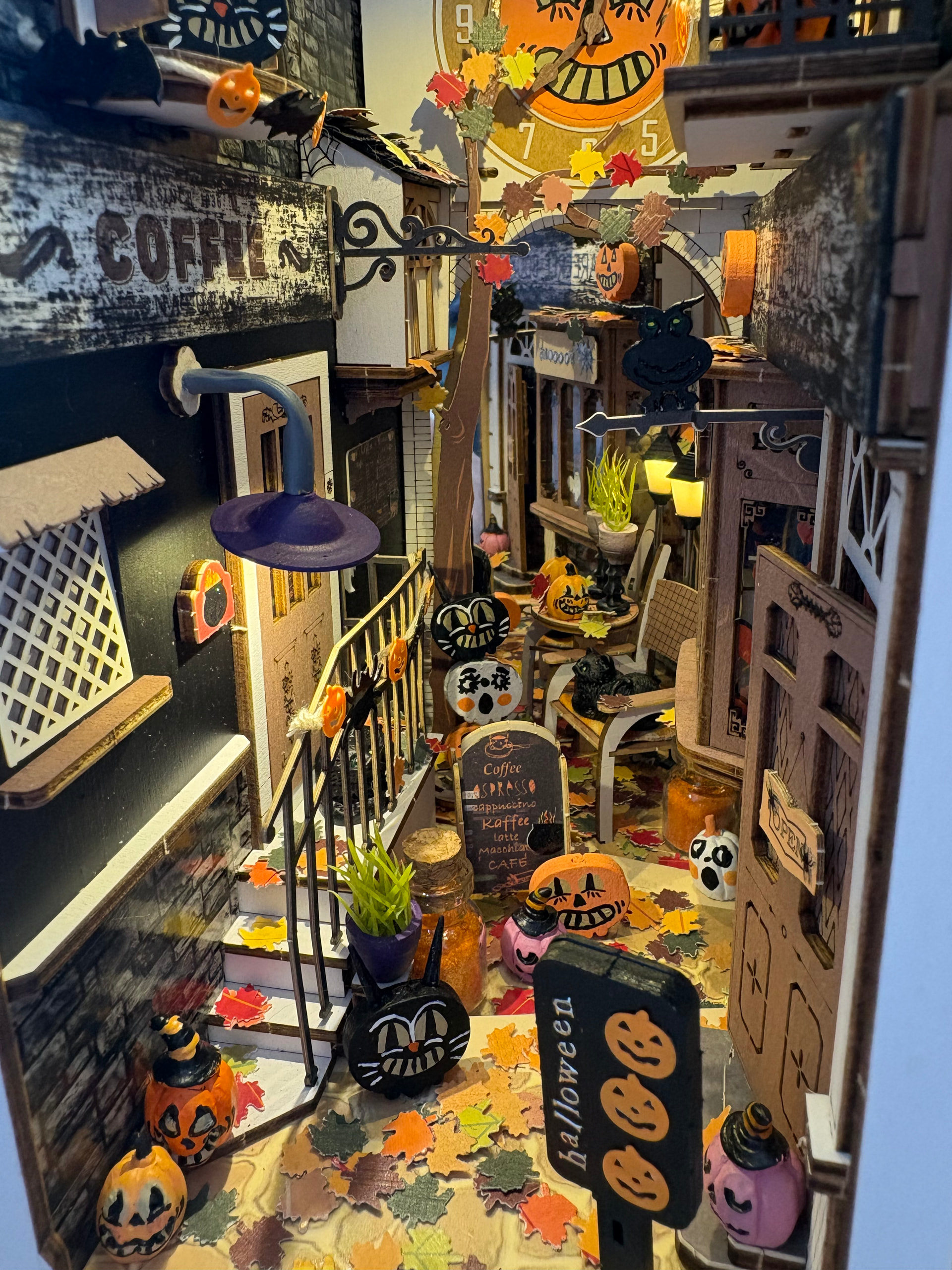 Hand-punched fallen leaves and tiny Halloween figures in the Sunshine Town makeover by Rolife Community maker Jessica_Nell