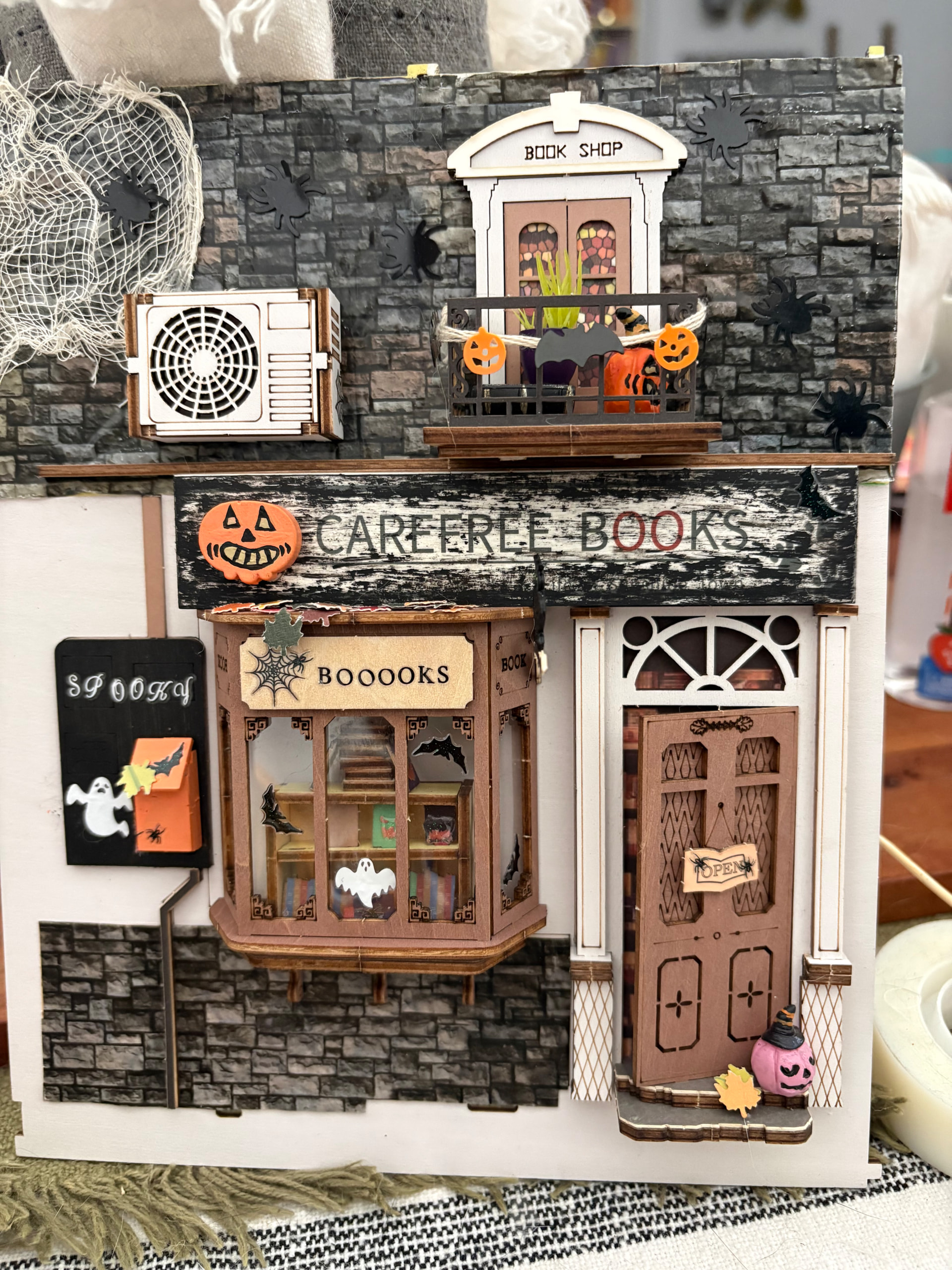 Bookstore facade with vintage Halloween details in the Sunshine Town makeover by Rolife Community maker Jessica_Nell