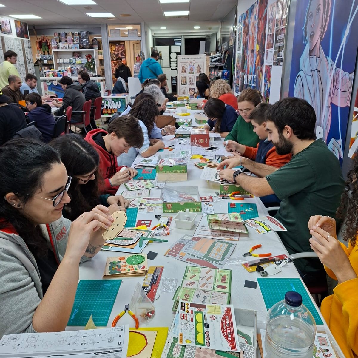Participants assembling Robotime DIY kits during the first Spain meetup in Barcelona.