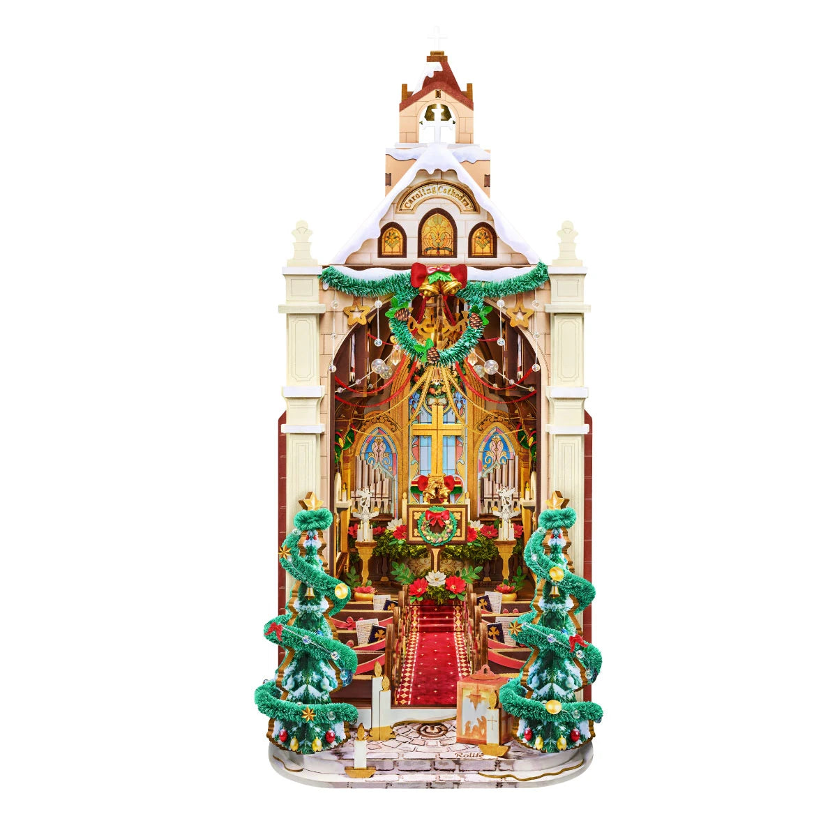 Rolife Caroling Cathedral TGB26 exterior with a snow-dusted roof, wreath, and twin decorated trees