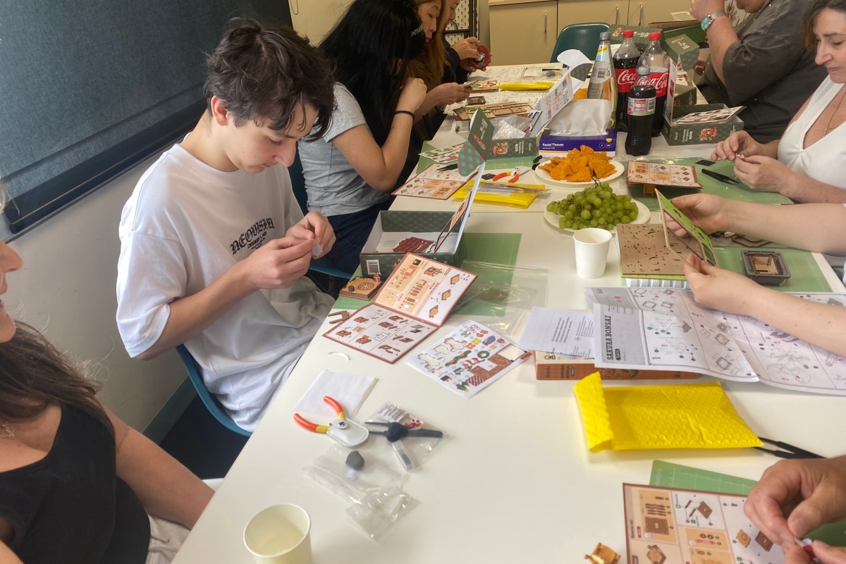 Crafters enjoying a calm and focused building moment at Robotime Melbourne meetup