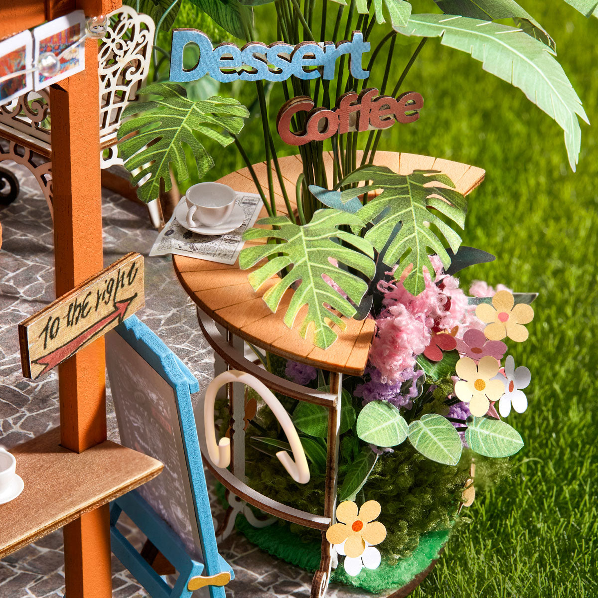 Leafree Café DH201 terrace with monstera leaves, flowers, and garden coffee details