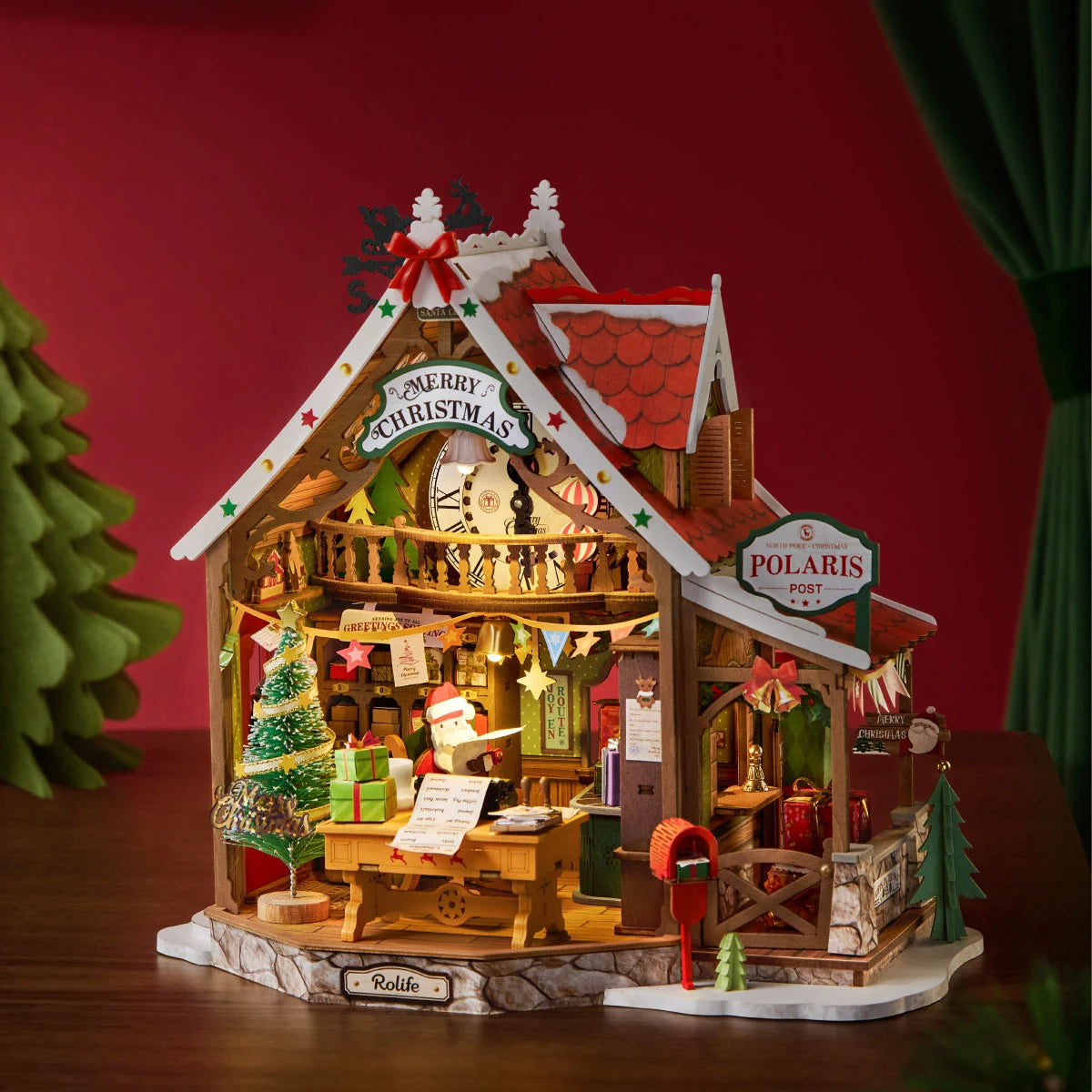 Rolife Polaris Post DG187 Christmas workshop miniature glowing against a red backdrop