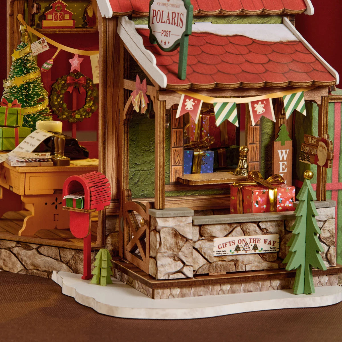 Close-up of the Polaris Post porch with red mailbox, signs, and Christmas greenery