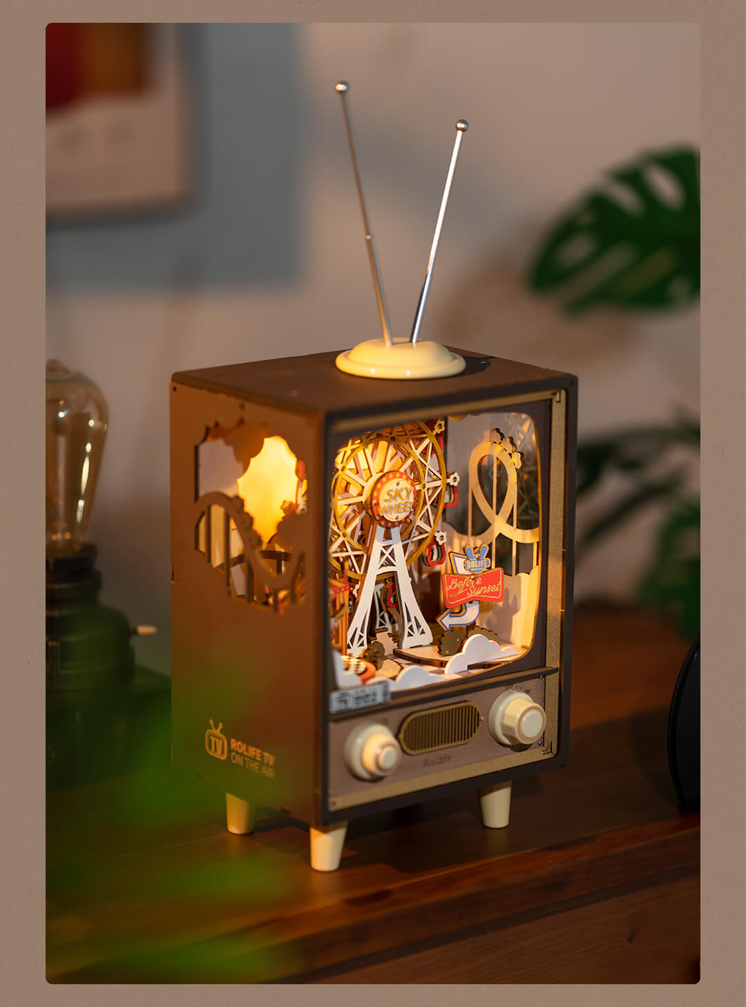 Rolife Sunset Carnival AMT01 side angle display scene graphic with warm glowing light