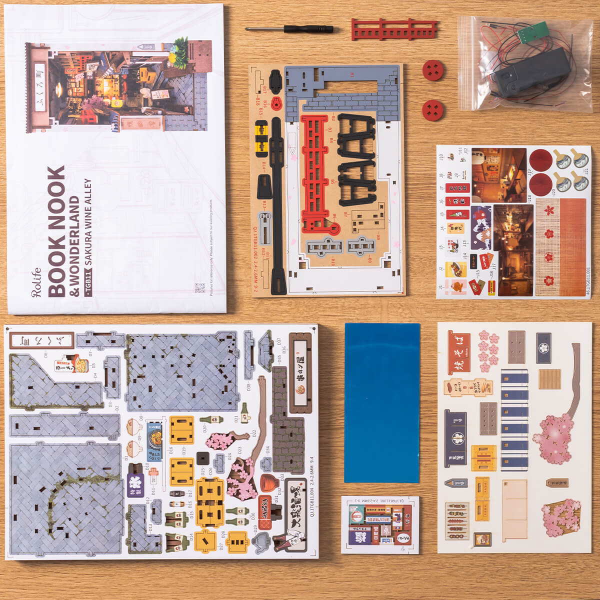 Components and printed details included with the Rolife Sakura Wine Alley book nook kit