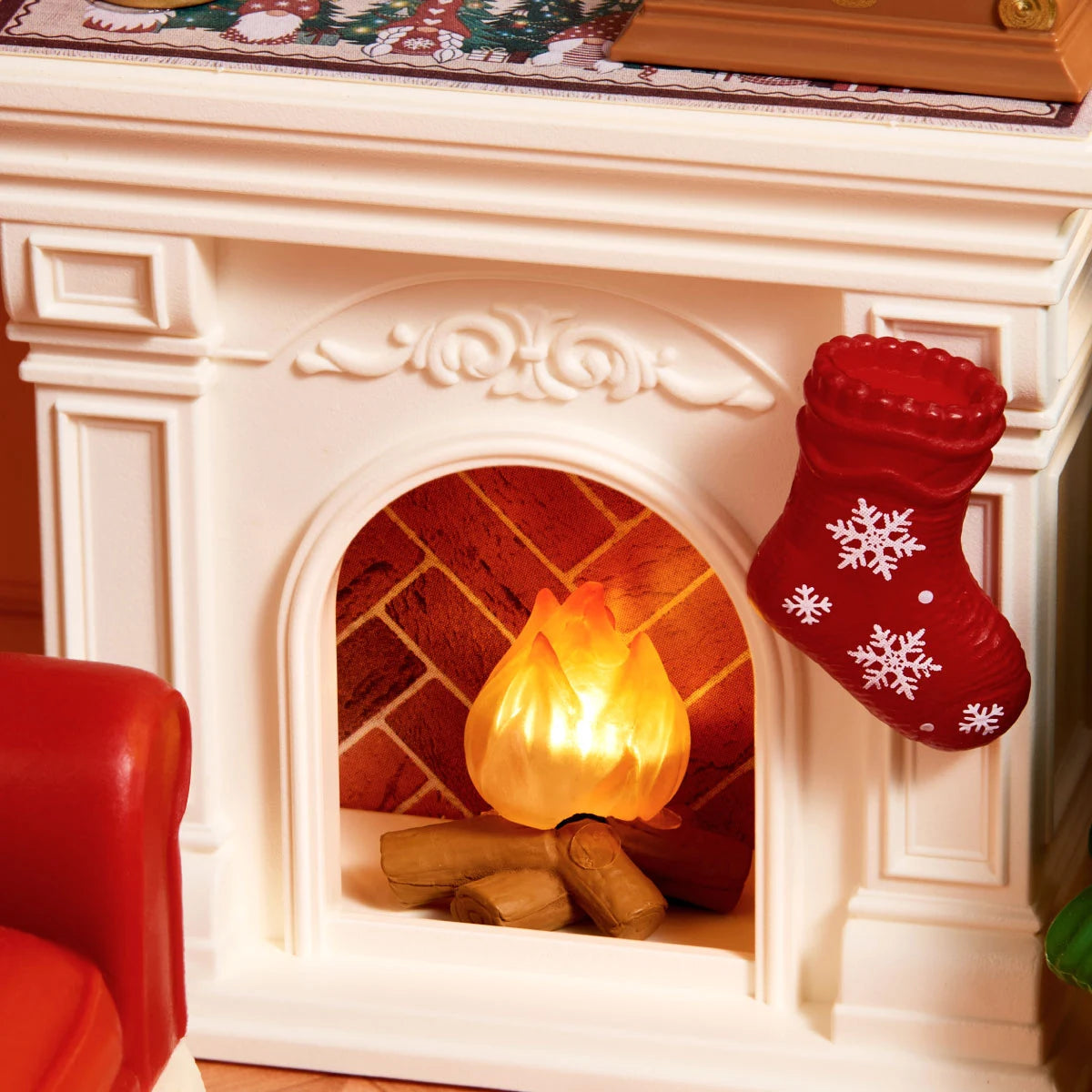Close-up of the glowing white fireplace, logs, and red snowflake stocking in Twinkling Christmas Eve DWZ03