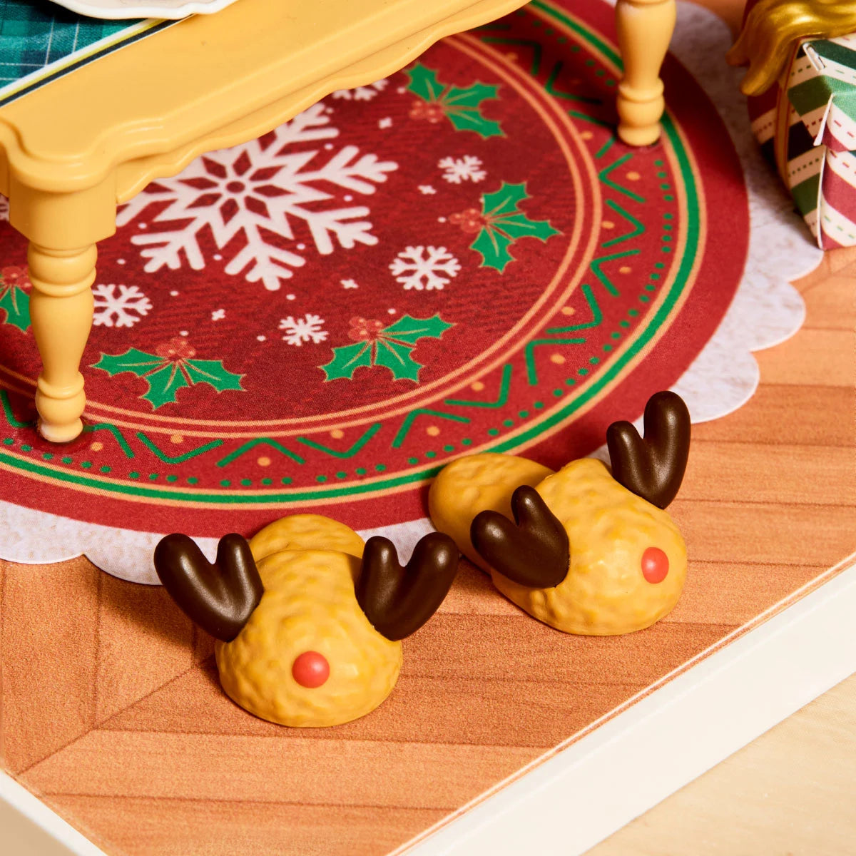Miniature reindeer slippers with antlers and red noses on the snowflake rug in Twinkling Christmas Eve DWZ03