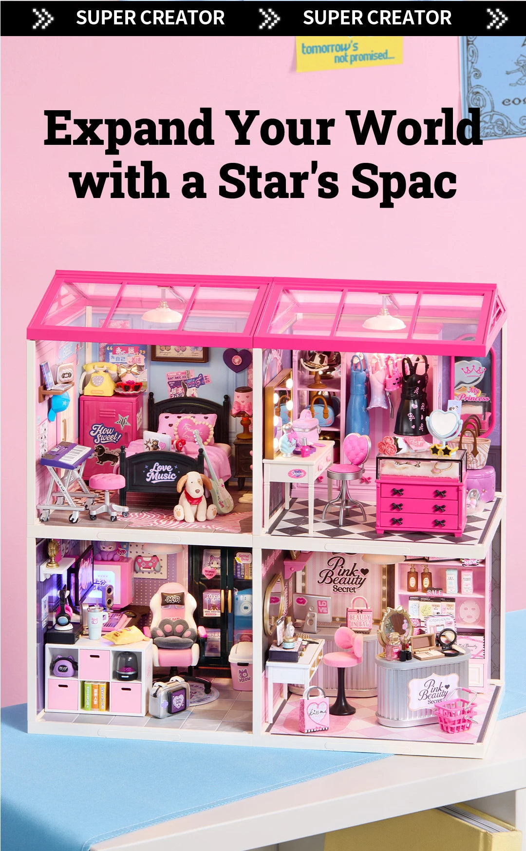 Two joined pink-roofed miniature house kits forming four rooms: bedroom, dressing room, gaming room and pink beauty shop, displayed on a pale blue surface.