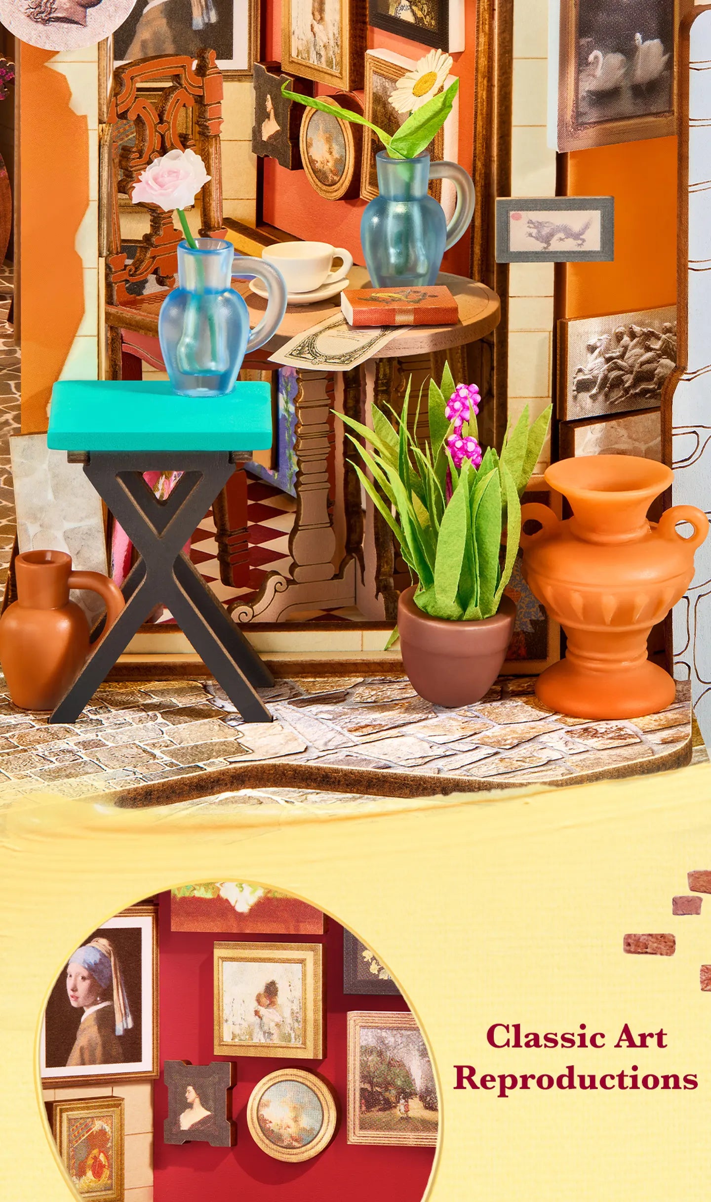Close-up of a miniature caf&eacute; corner with a blue jug, white cup, orange vase, potted plant, wooden chair and framed classic art reproductions.