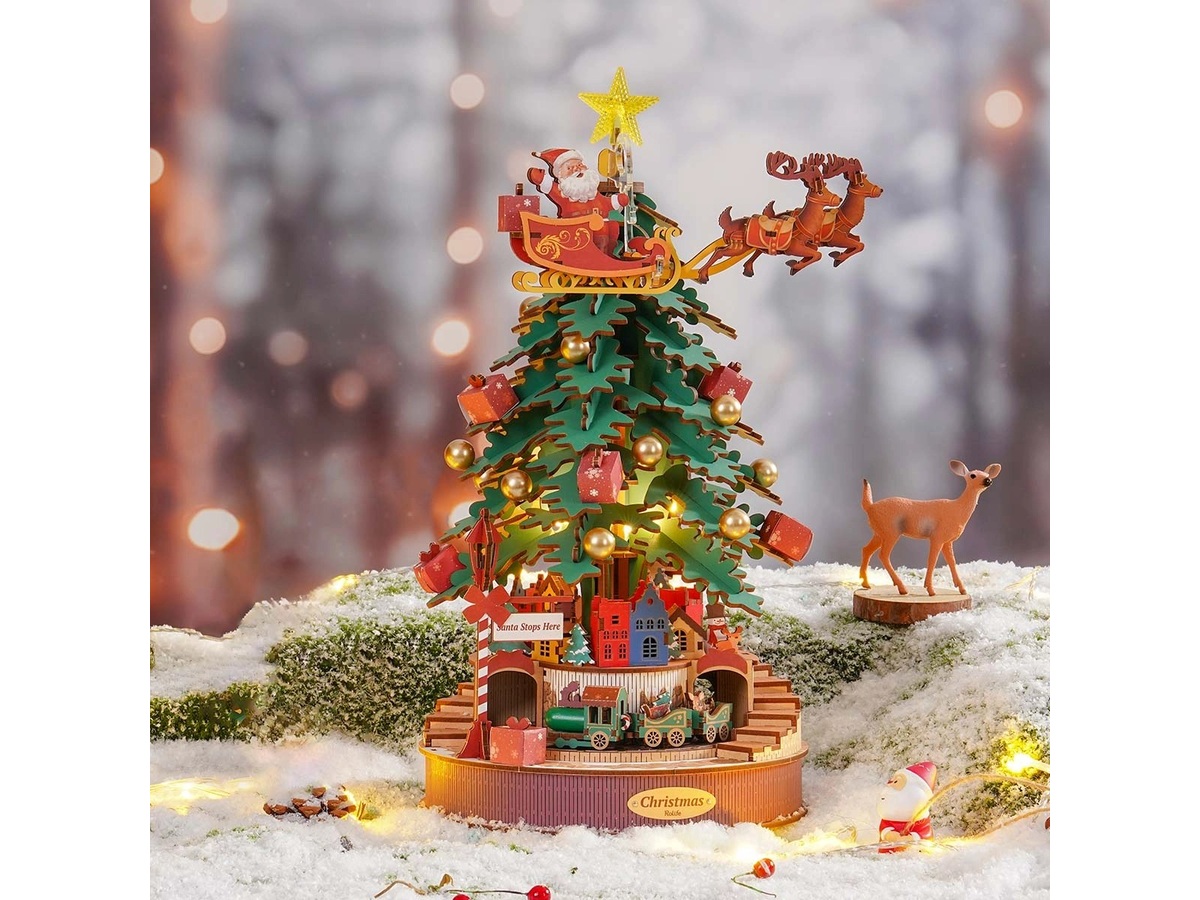 Rolife Christmas Melody Tree AMS01 with Santa sleigh and miniature village in a festive display