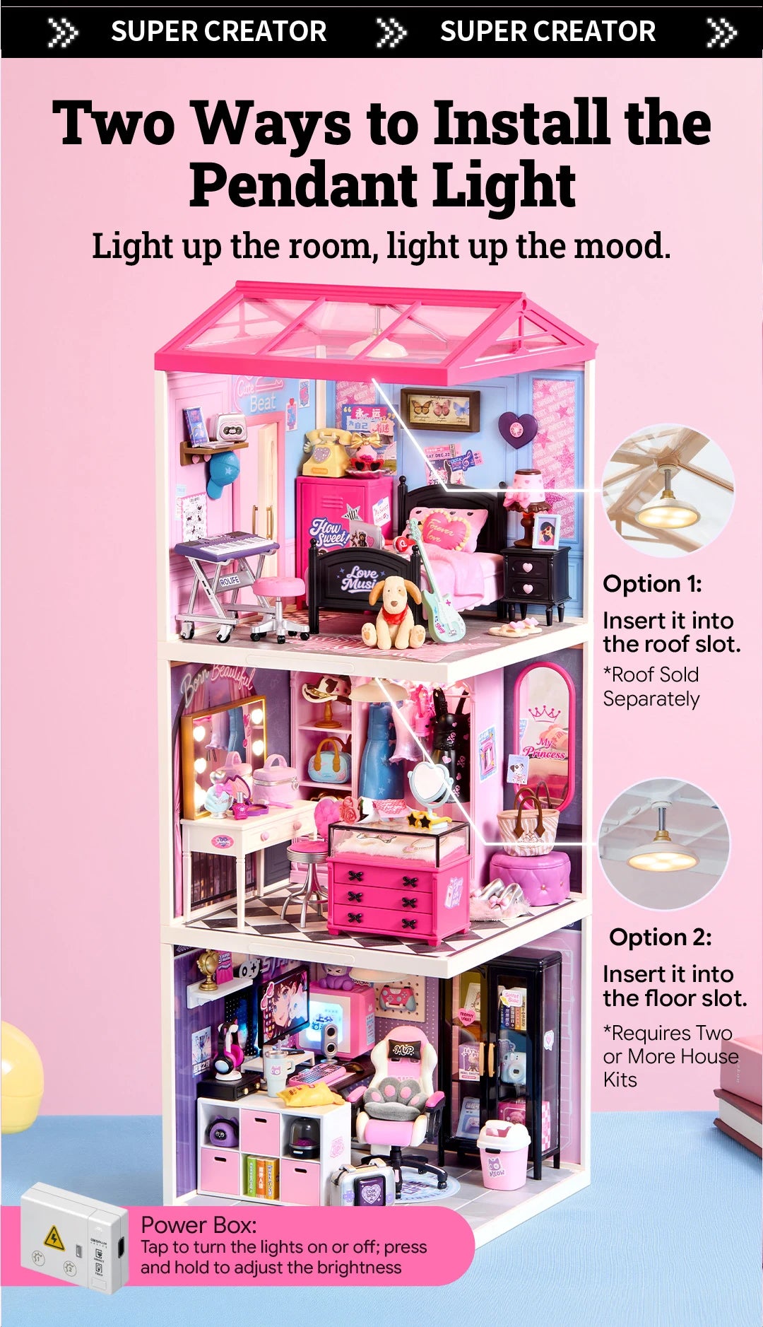 Three-storey pink miniature house with bedroom, dressing room and gaming room, showing pendant light installation in roof or floor slots and a power box.