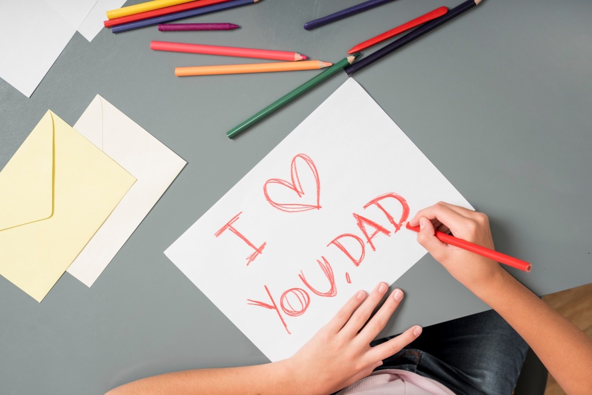 Writing a thoughtful personal journal entry at home