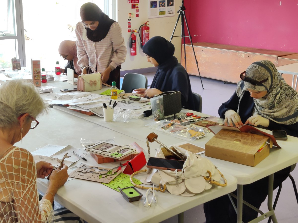 New participants assembling miniature kits at Leicester Meetup 04