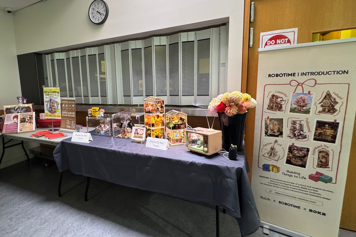 A welcome table and Robotime project display in the Markham meetup room