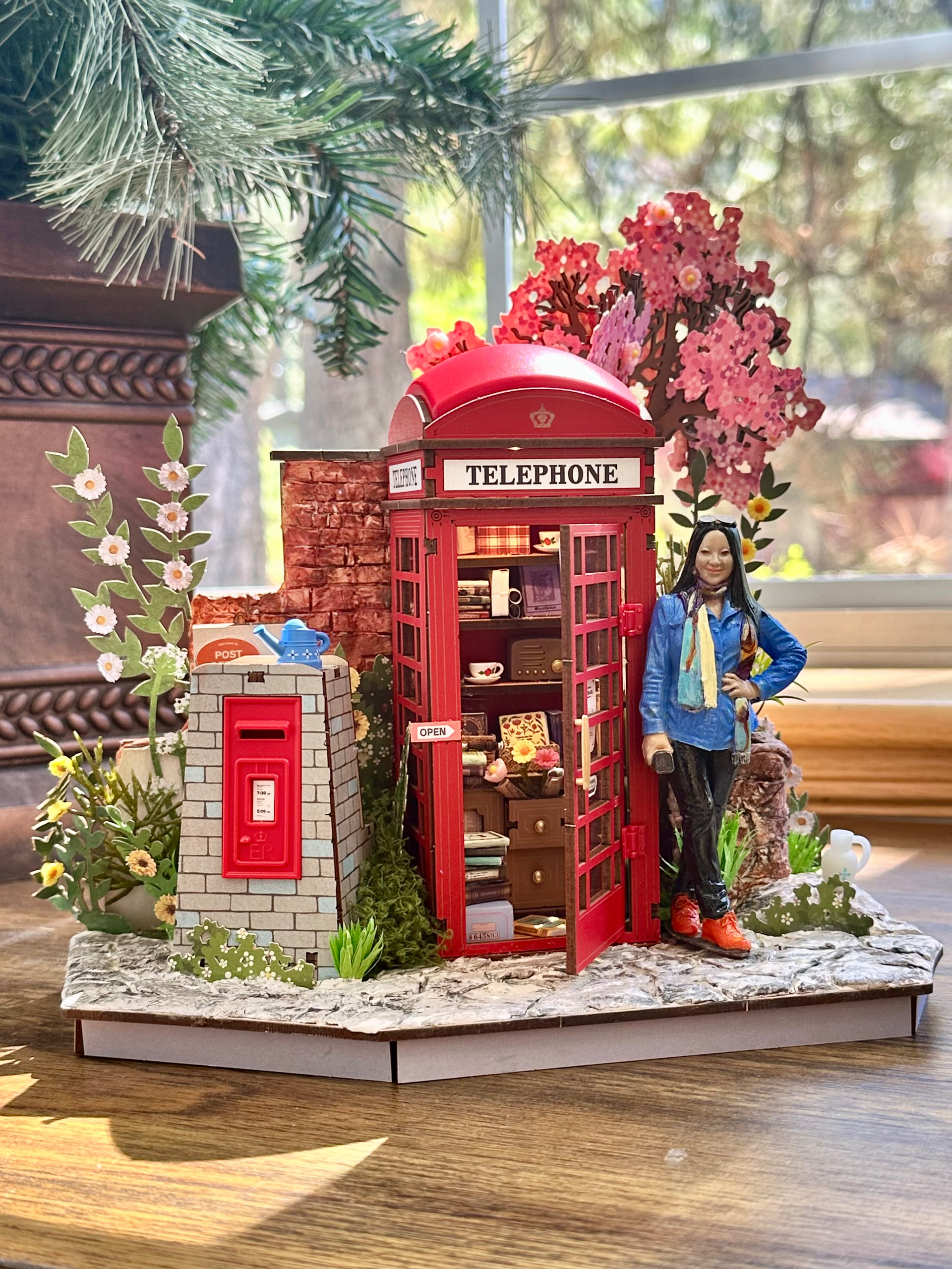 Rolife Community creator mchipman's customized Blossom Book Booth with a handmade miniature self-portrait
