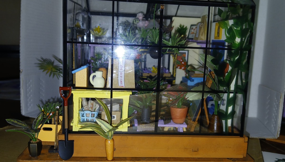 Side view showing plants and garden tools in Nita_Davis’s Cathy’s Flower House DG104