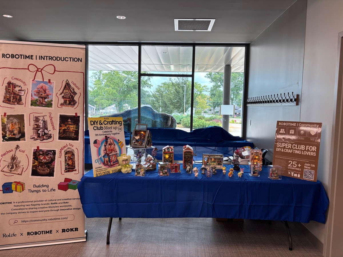 Robotime models and meetup signs displayed at North Webster Community Public Library