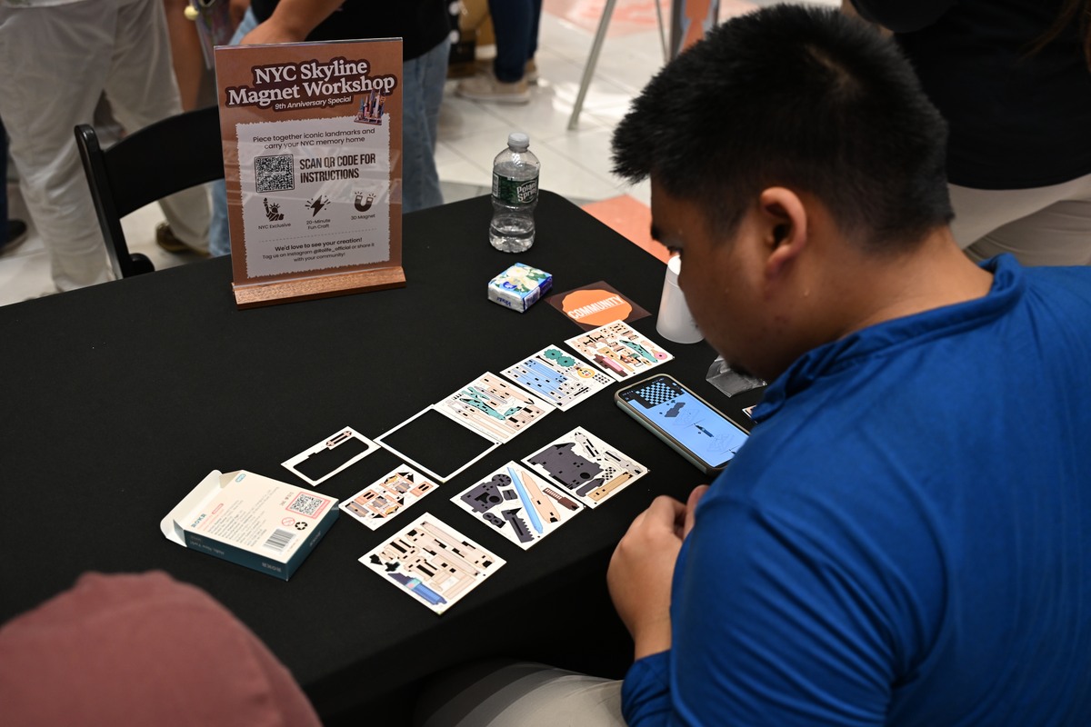 Guest assembling the NYC Skyline Magnet at the Rolife workshop