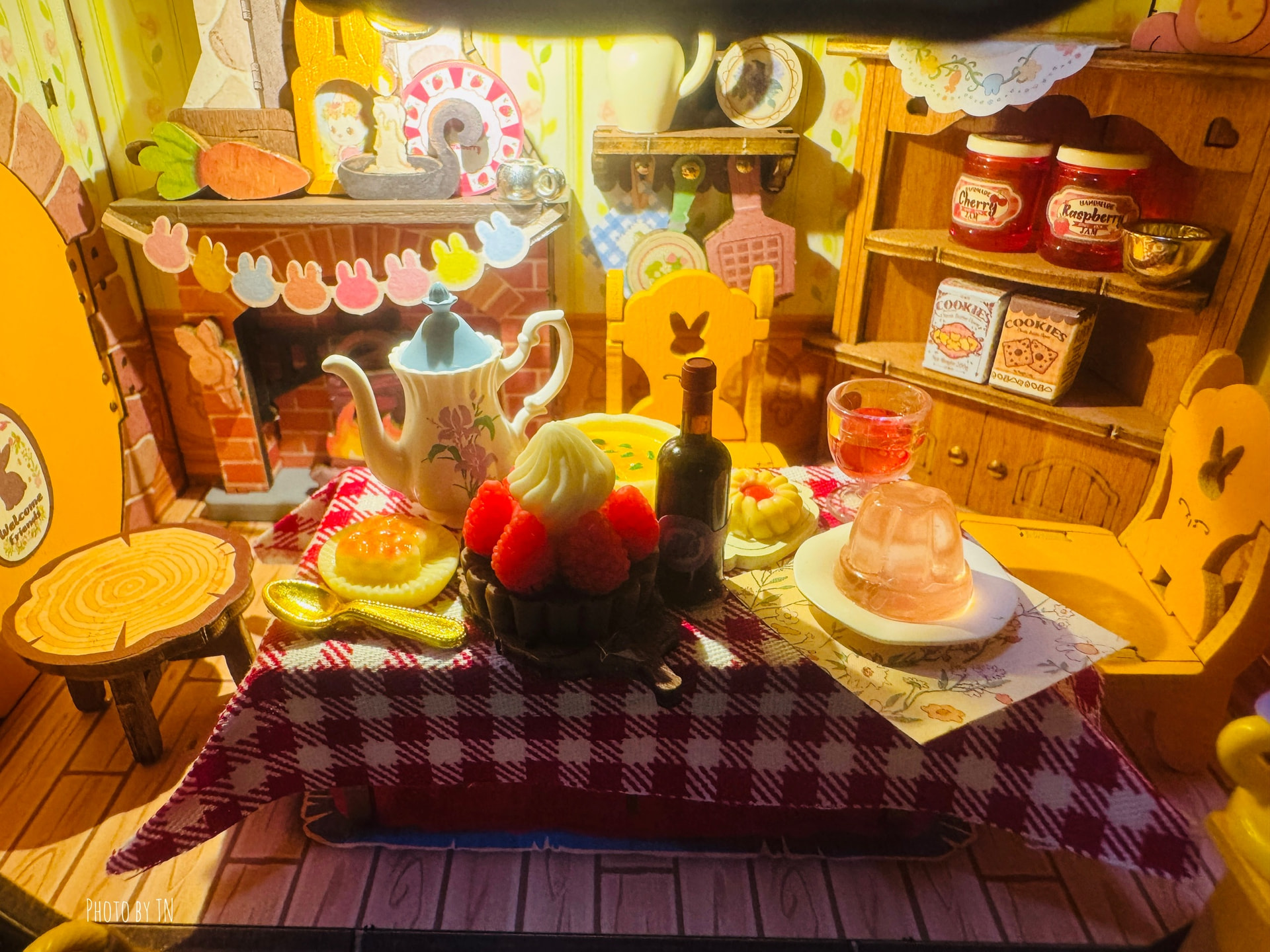 Rolife Community maker ThaoNguyen's Fluffy Grove dining table with tea, pastries, and strawberries