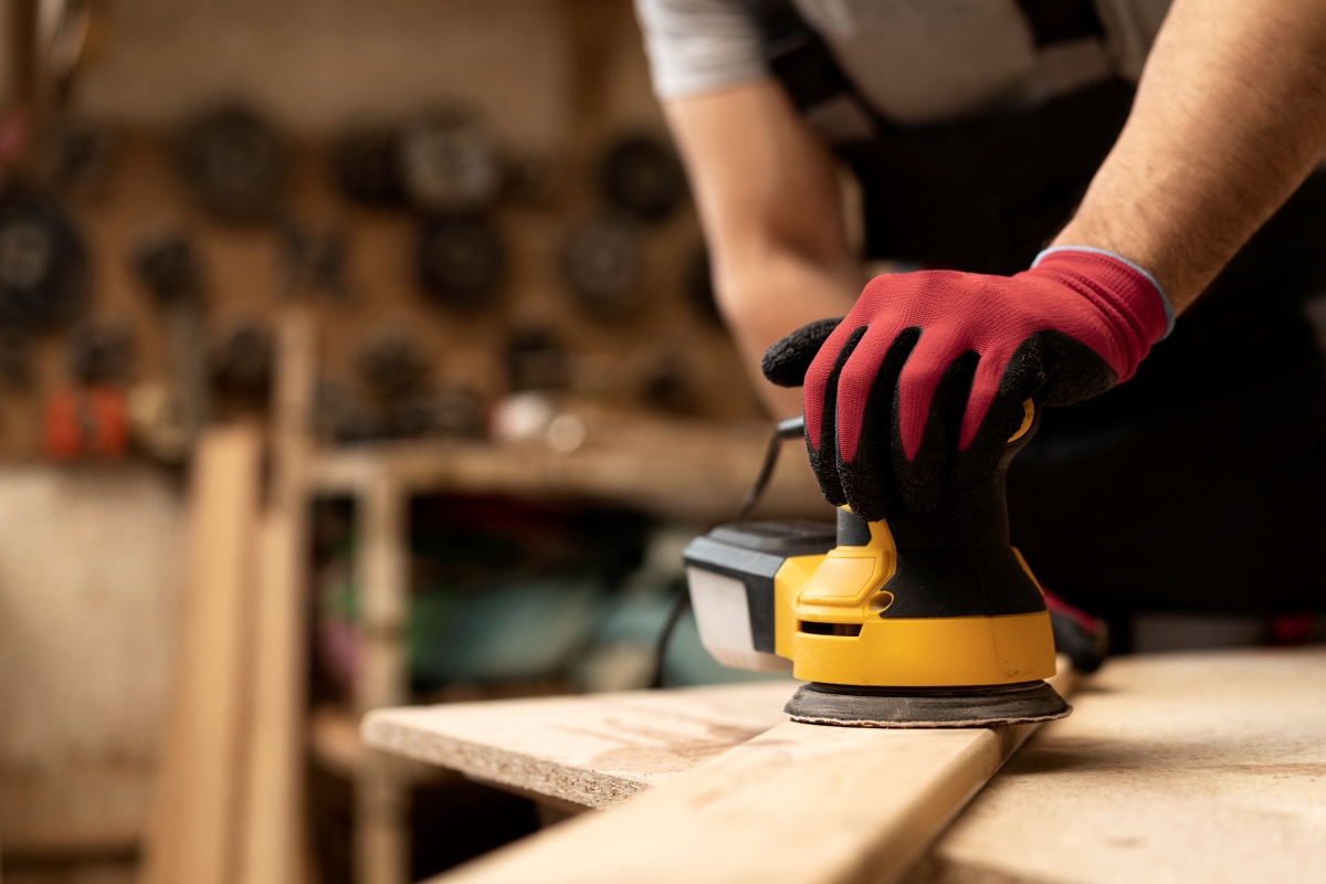 sanding the wooden surface