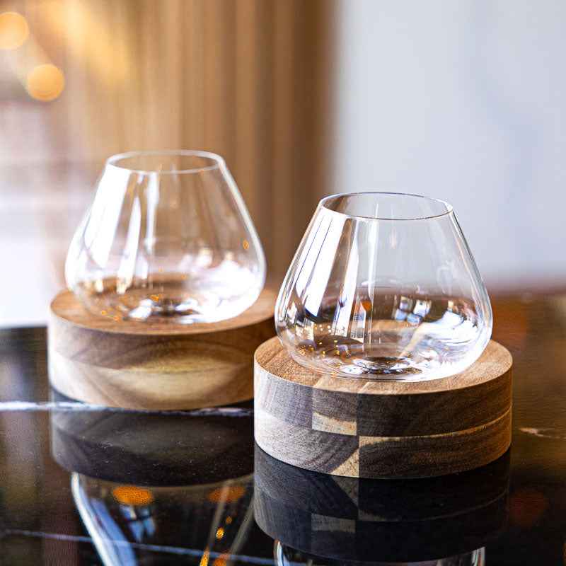 Spinning tumbler whiskey glass