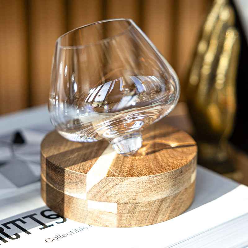 Spinning tumbler whiskey glass