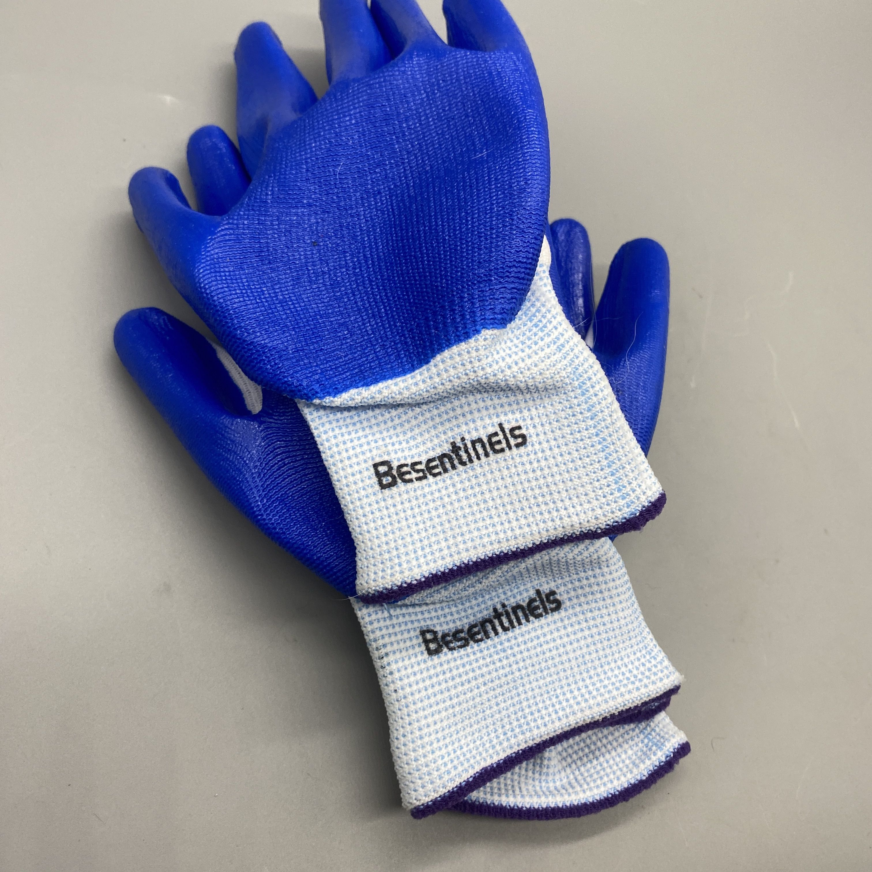 Besentinels Protective Work Gloves - Nitrile Rubber, Nylon Knit Lining, Size 9/L, White & Blue, Industrial Safety for Mechanical, Shipbuilding, Metallurgy, Forestry, Mining, Construction, and Warehouse Handling