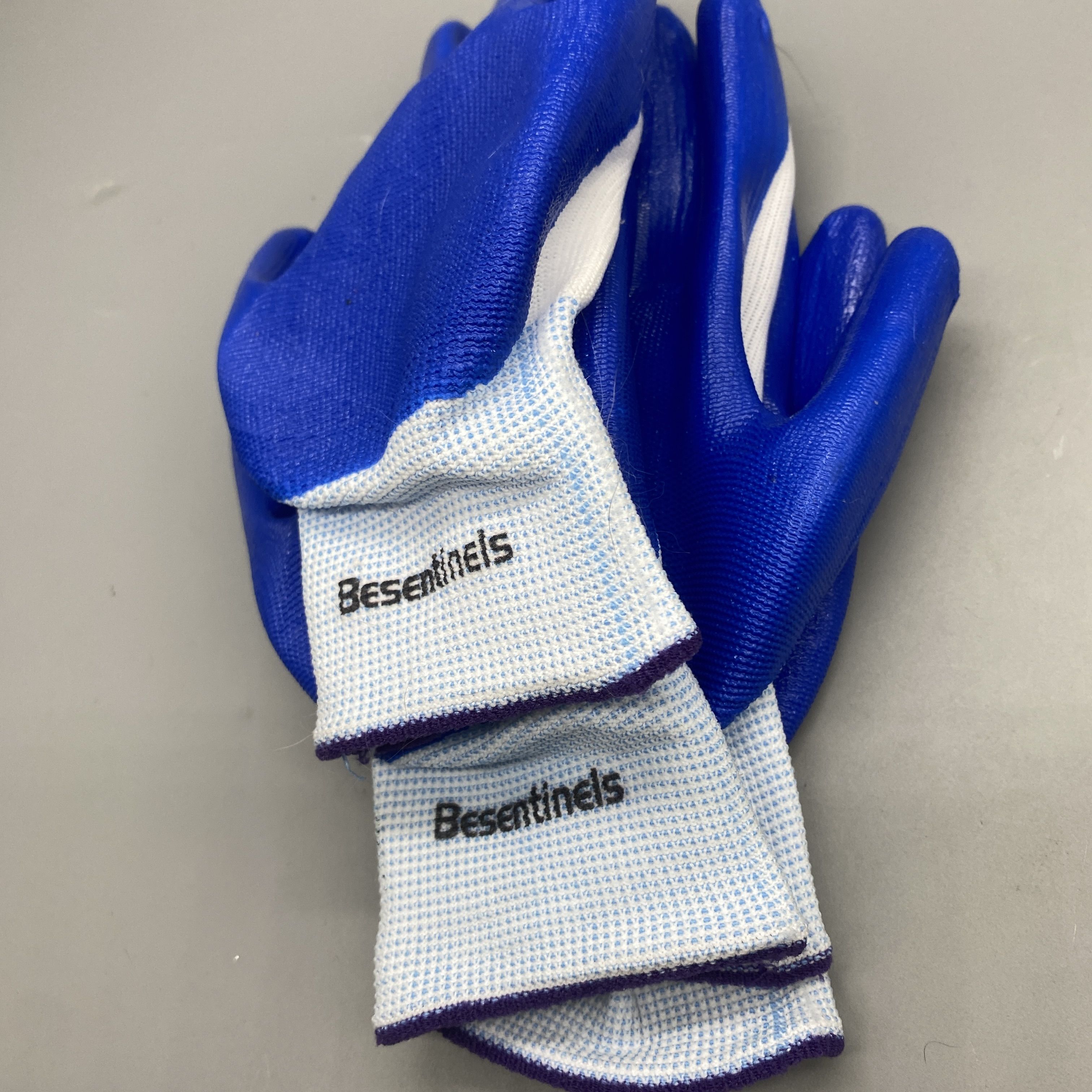 Besentinels Protective Work Gloves - Nitrile Rubber, Nylon Knit Lining, Size 9/L, White & Blue, Industrial Safety for Mechanical, Shipbuilding, Metallurgy, Forestry, Mining, Construction, and Warehouse Handling