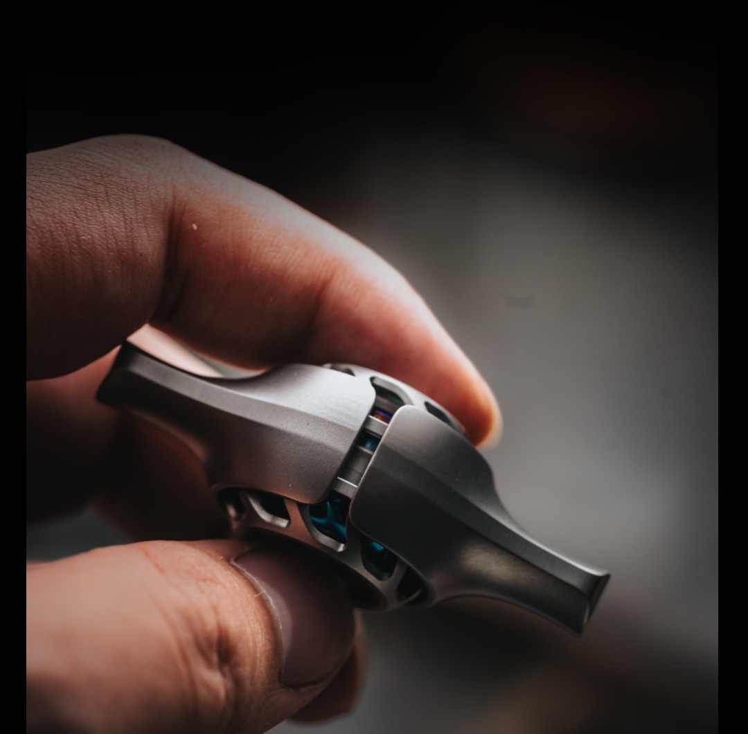 The Betz Ball spinner held between fingers