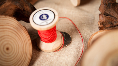 Needle Thru Coin by Artisan Coin & Nathan Kranzo