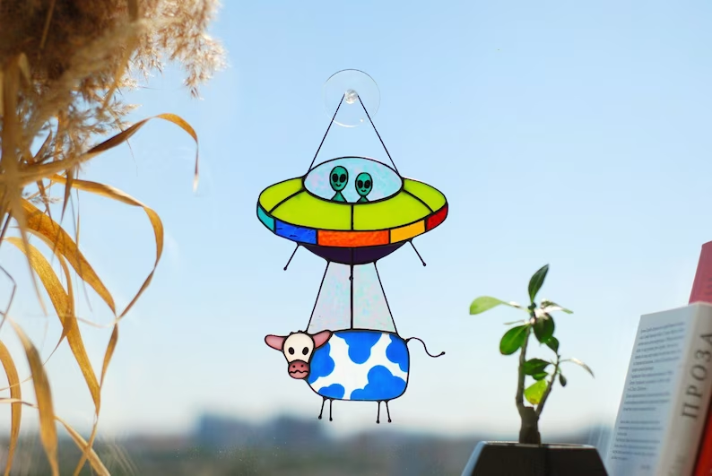Stained glass UFO Abduction a cow 