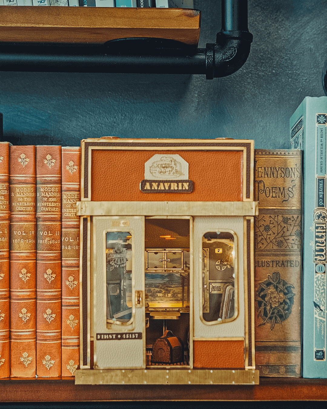 DIY fun with the 1940s Train Cabin DIY Book Nook Shelf Insert Craft Kit by Anavrin: Assemble a moving scene with cozy cabin seats