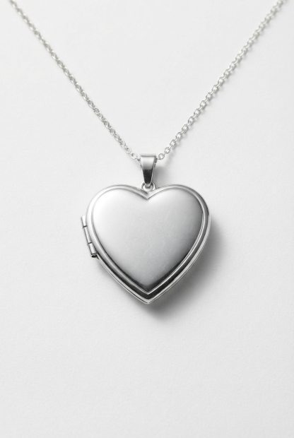 Heart photo locket necklace on off-white background