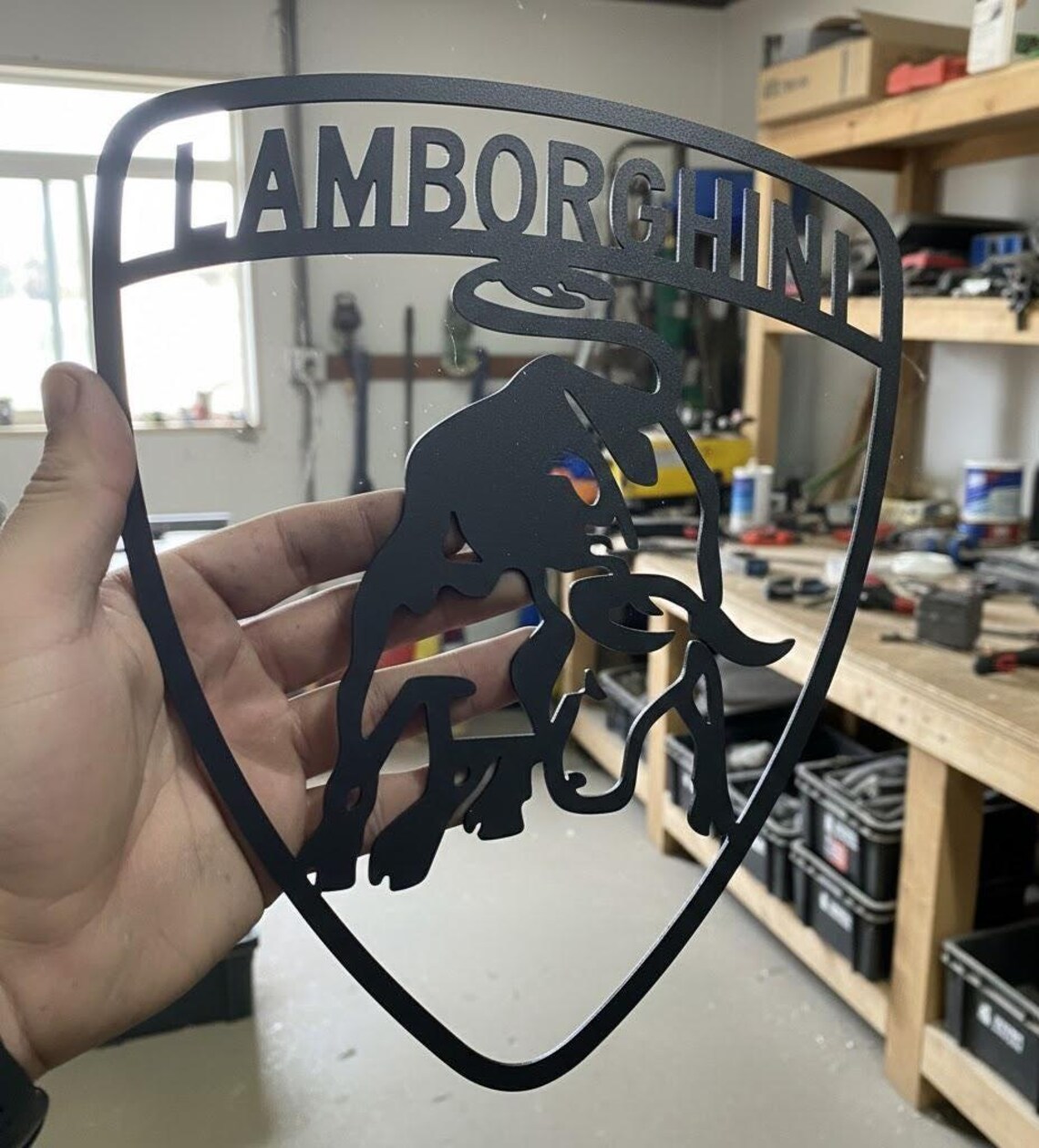 Side angle close-up of the Lamborghini prancing bull shield metal wall sign