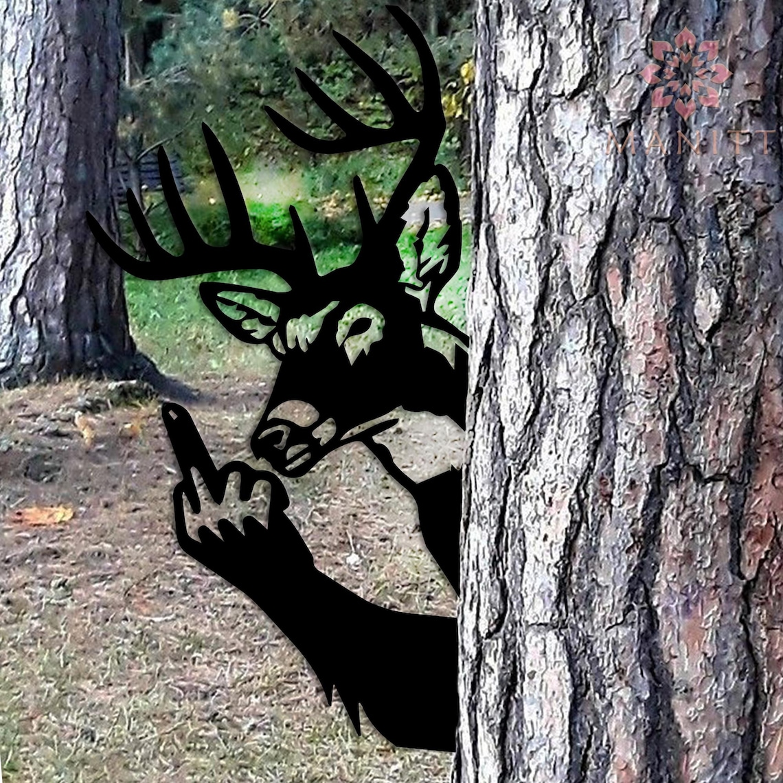 May include: Black metal deer silhouette with antlers, giving the middle finger. The deer is partially hidden behind a tree trunk in a forest setting. The artwork is a humorous outdoor decoration.