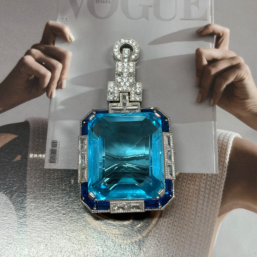 Vintage Emerald Cut Aquamarine Brooch With A Halo Sapphire 