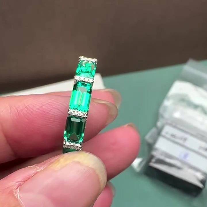 10ctw Emerald Cut Emerald & White Sapphire Pavé Eternity Band