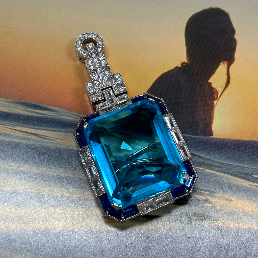 Vintage Emerald Cut Aquamarine Brooch With A Halo Sapphire 