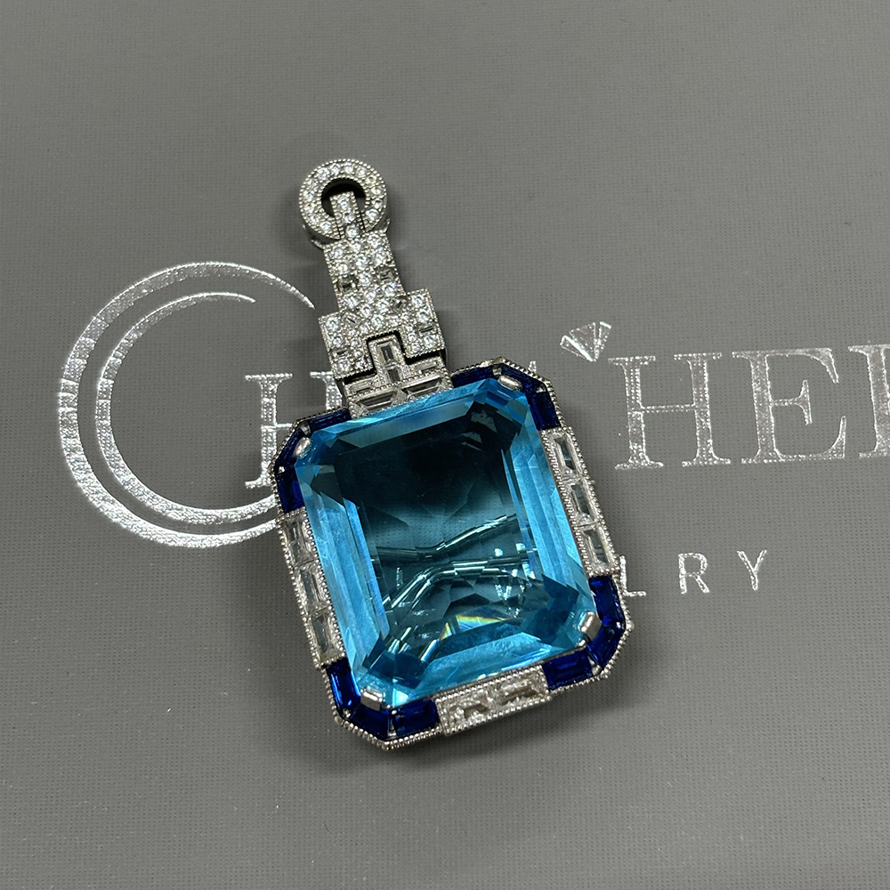 Vintage Emerald Cut Aquamarine Brooch With A Halo Sapphire 