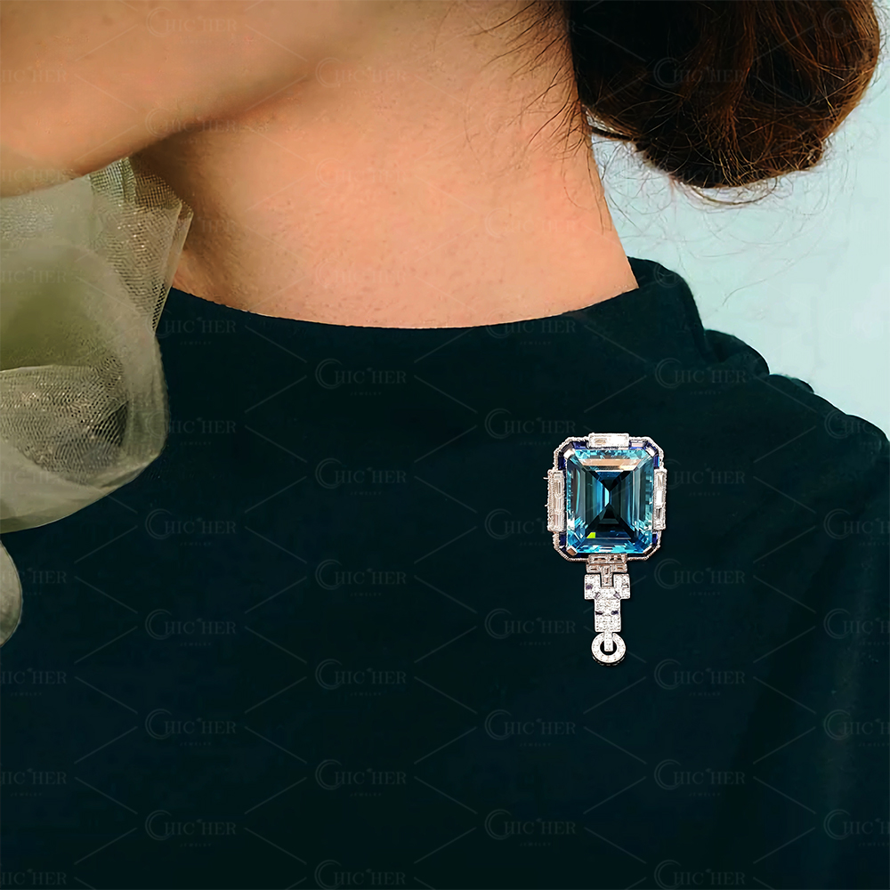Vintage Emerald Cut Aquamarine Brooch With A Halo Sapphire 