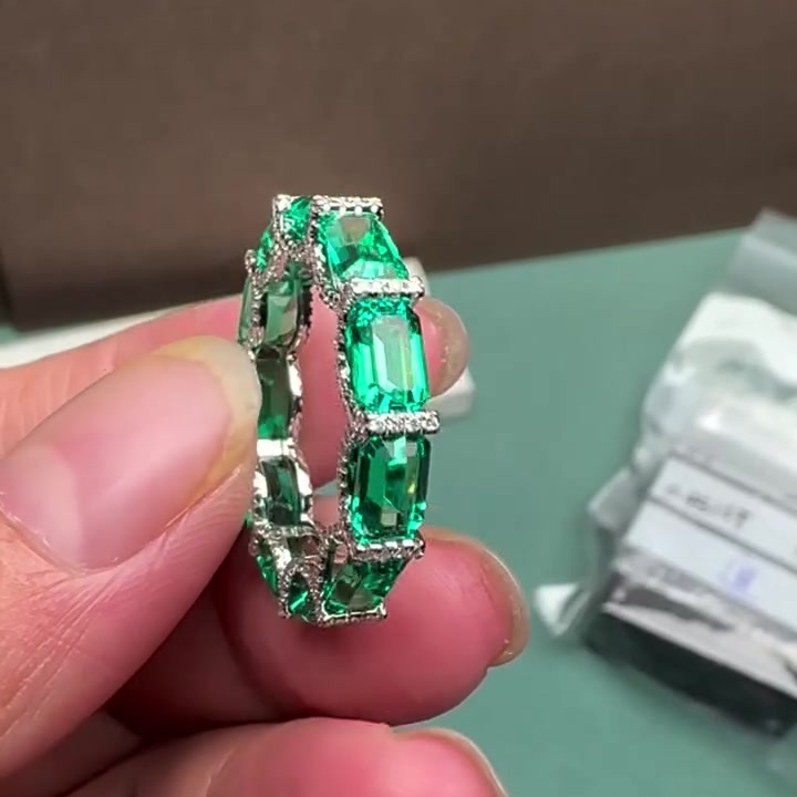 10ctw Emerald Cut Emerald & White Sapphire Pavé Eternity Band