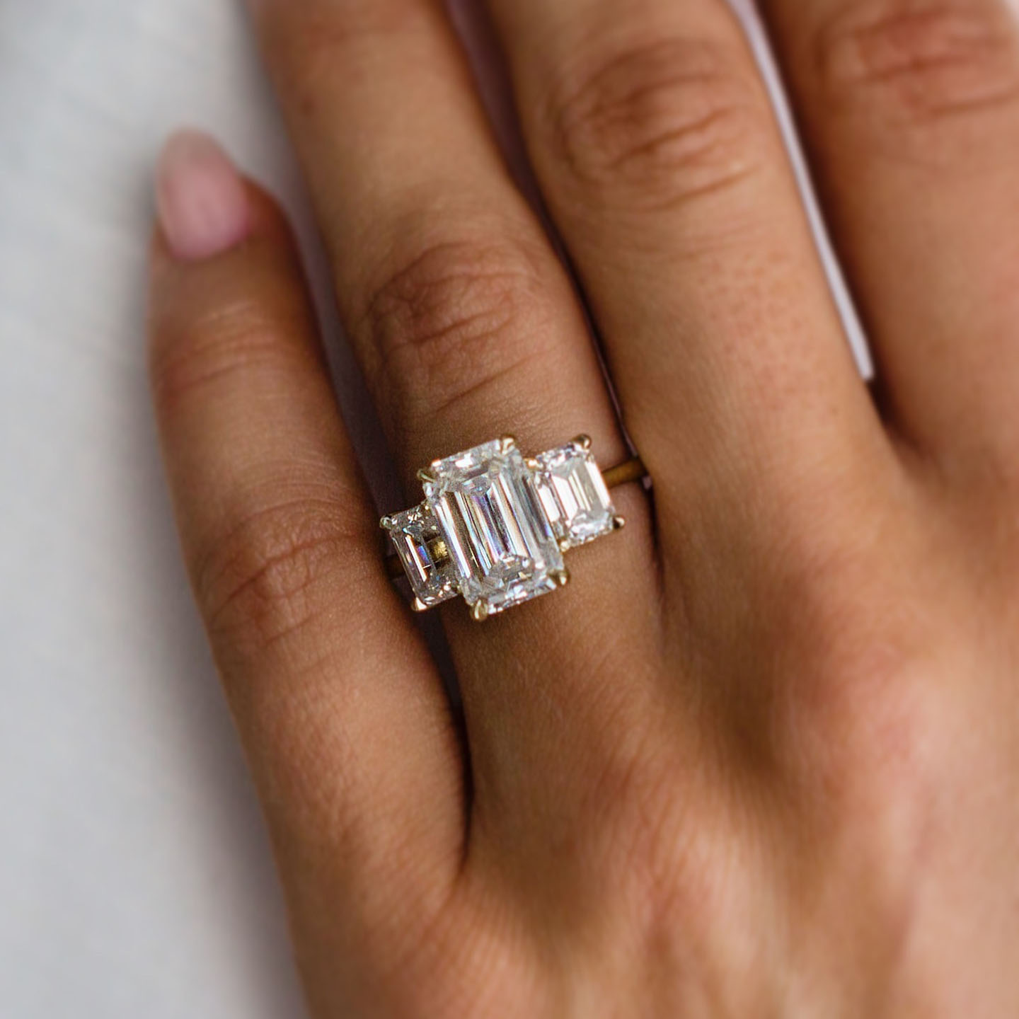 4.5ct Step Emerald Cut Three-Stone Engagement Ring