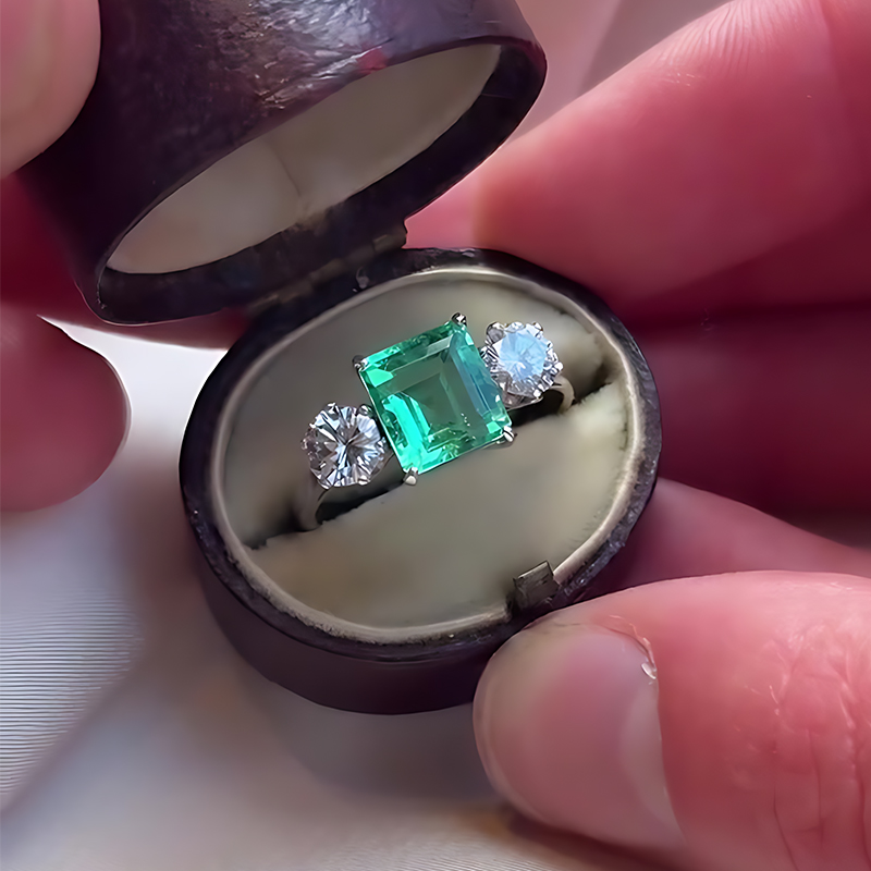 Classic 3ct Emerald Cut Emerald & White Sapphire Three Stone Engagement Ring