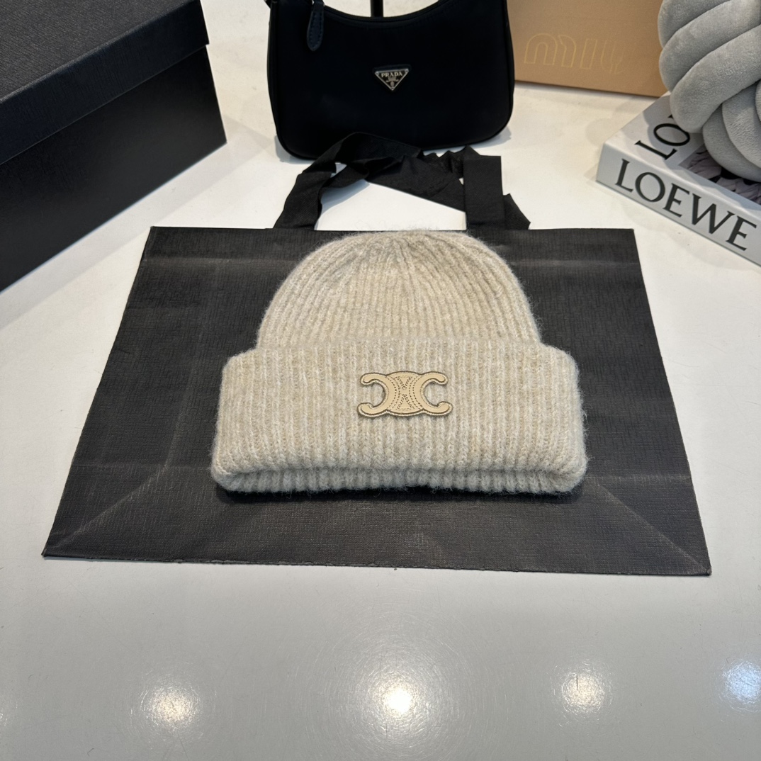 C black, white and khaki wool hat