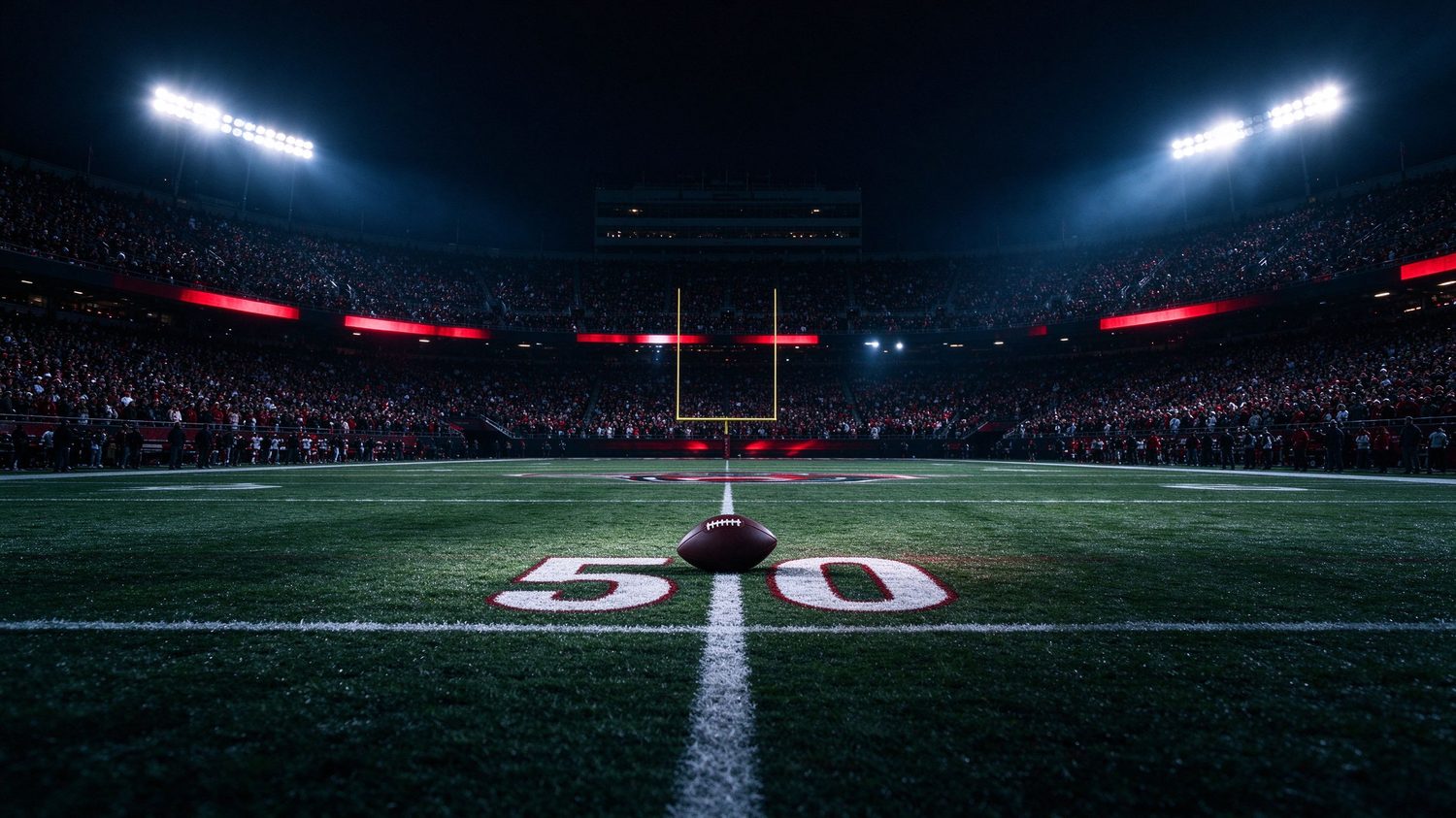 Football stadium under night floodlights