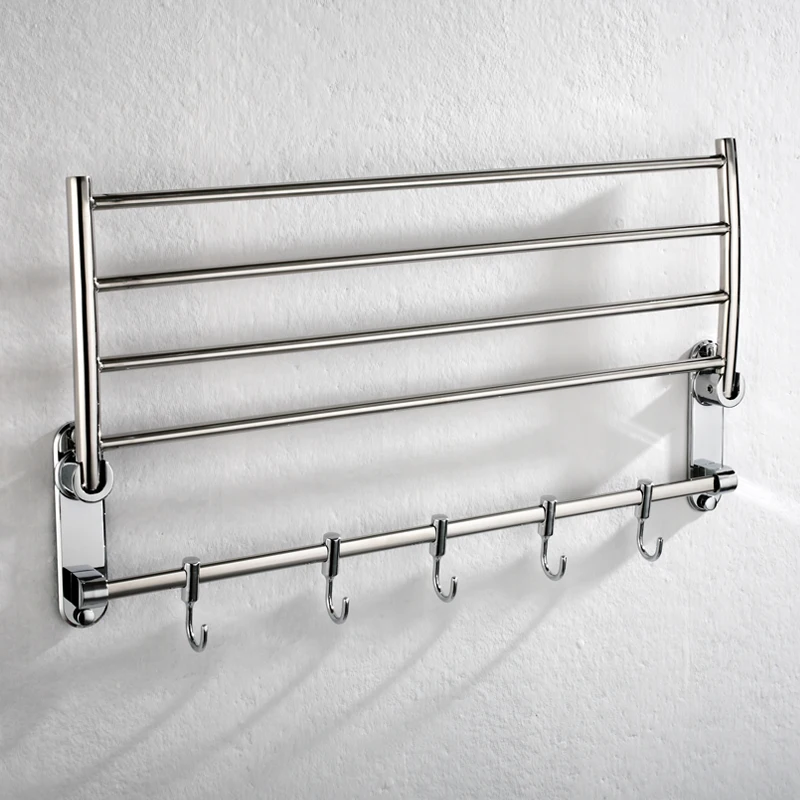 Front view of stainless steel hotel style towel rack with shelf and bar