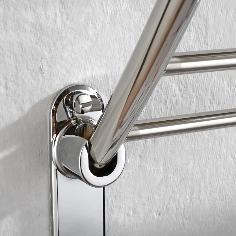 Close-up of polished stainless steel towel rack joints and welding details