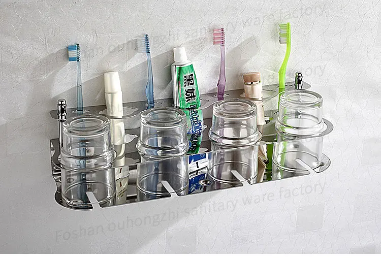 Stainless steel wall-mounted tumbler holder with glass cup and storage shelf